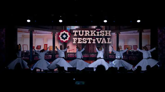 Image of Turkish Festival Logo overlayed on top of Ottoman band on stage at the 2025 Turkish Festival